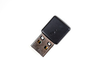 Black USB dongle isolated on white background