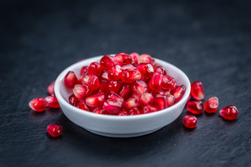 Pomegranate on a slate slab (selective focus)
