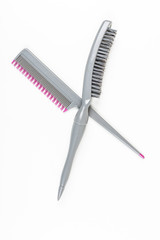 Teasing brush and comb isolated on white background