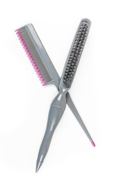 Teasing brush and comb isolated on white background