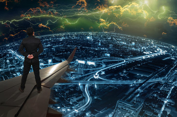 businessman standing on airplane wing and looking the thunder li