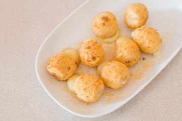 Bake cheese ball on white dish.