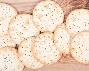 Wheat crackers on olive wood cutting board 