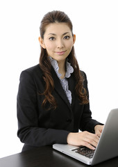 Businesswoman working on laptop