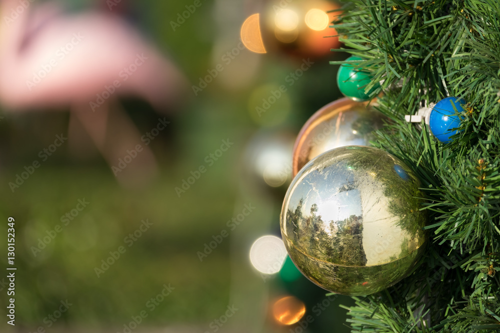 Wall mural Christmas colorful ball decorate on pine tree copy space blur ba