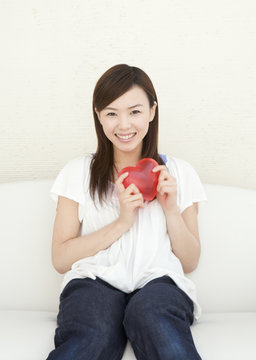 Woman Holding Heart Shaped Toy