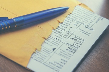 Naklejka premium Business document with pen on the desk