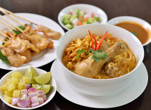 Khao Soi Chicken, northern Thai noodle dish with chicken and coc