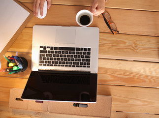 Young female working sitting at a desk