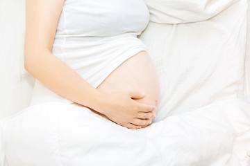 Fototapeta na wymiar Pregnant young woman relaxing