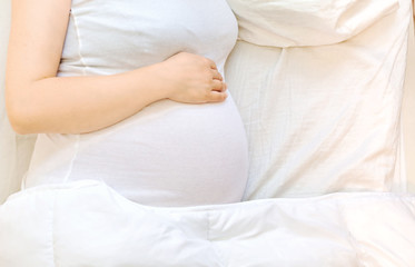 Fototapeta na wymiar Pregnant young woman relaxing