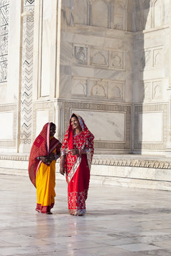 Women in colourful saris at the Taj Mahal, Agra, Uttar Pradesh state