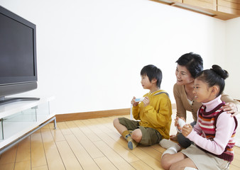 Grandmother and grandkids playing video games