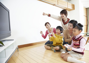 Three-generation family playing video games