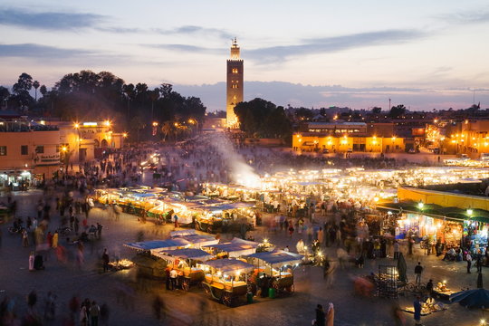 Elevated view of the Koutoubia Mosque at dusk from Djemaa el-Fna, Marrakech, Morocco 