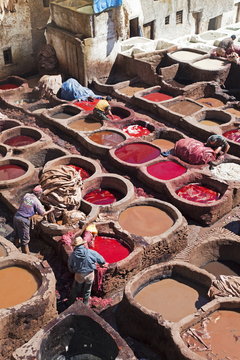 Vats for tanning and dyeing animal hides and skins, Chouwara traditional leather tannery in Old Fez, Fez, Morocco
