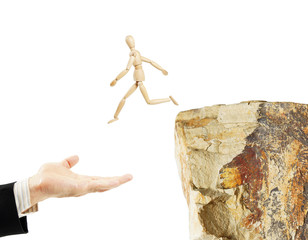 Rescue of the man who jumped from the rock. Abstract image with a wooden puppet