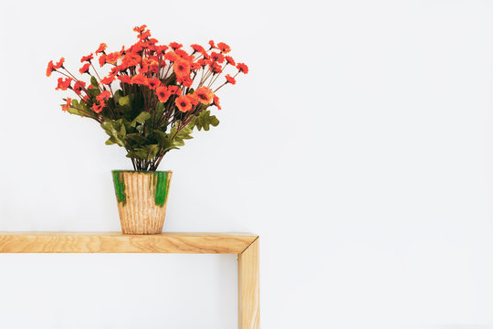 Interior Home Concept. Virtual Orange Flowers On Wood Table With