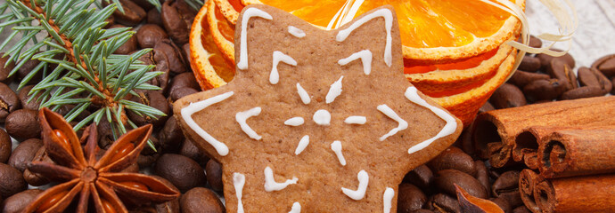 Decorated gingerbread, coffee grains and spices, christmas time