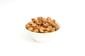 Chocolate popcorn in white Bowl on white background.