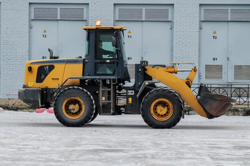 big tractor removes snow