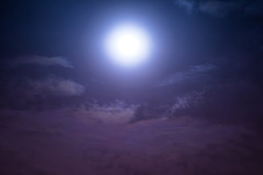 Nighttime sky with clouds and moonlight with shiny.
