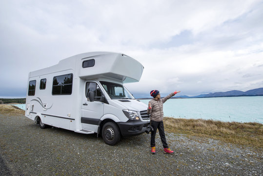 Camping car and woman, Lake Pukaki South New Zealand