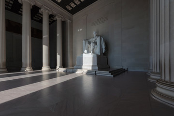 Statue of Abraham Lincoln at sunrise in the Lincoln Memorial Washington DC USA