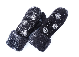 mittens winter clothes on snow background