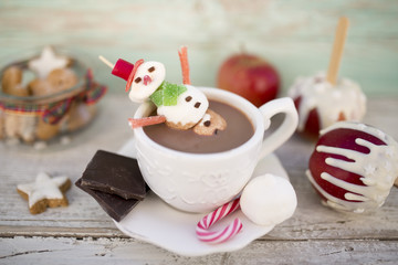 Marshmallow snowman in hot chocolate. Winter sweet delicious. 