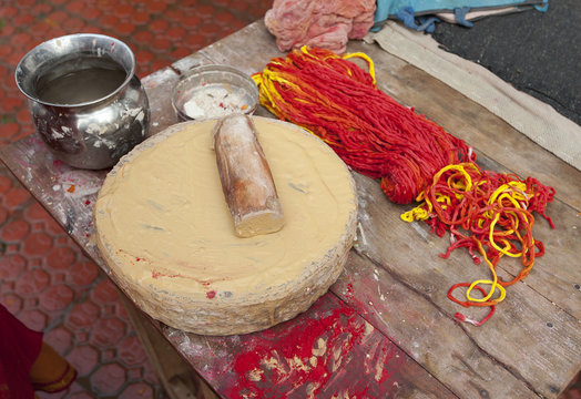 Sandalwood paste for tilaks, and kumkum, the sacred combination of holy thread and coloured powder, Sonepur, Bihar
