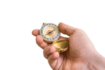Antique brass compass in a hand isolated on white © andriano_cz