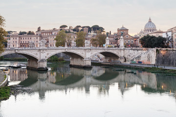 Rome skyline with Tiber and bridge in twilight