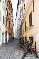 narrow street with bicycles in Rome city