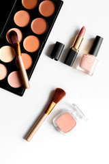 decorative cosmetics nude on white background top view