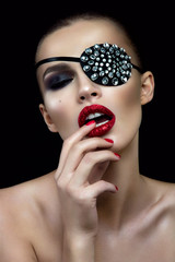 Fashion beauty woman portrait with shiny bandage on eye and red lips. - 130178512