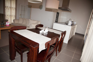 Fototapeta na wymiar brown table in house with kitchen