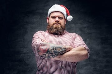 Bearded male wearing Santa's New Year hat.