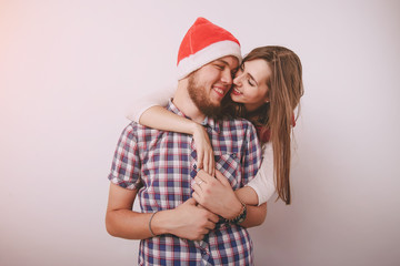 Fototapeta premium loving couple decorating Christmas tree