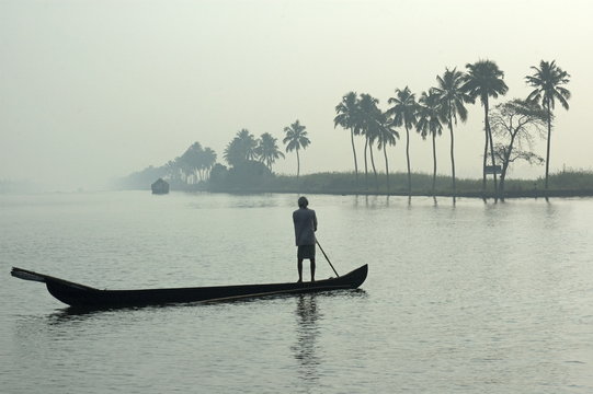 Canoe at dawn on backwaters, Alleppey District, Kerala
