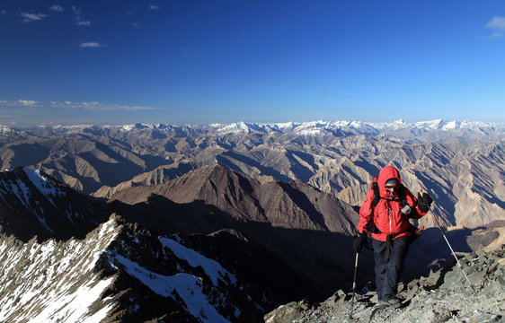 A climber makes her way up the summit ridge of Stok Kangri at 6137 metres, a popular and easily accessible trekking peak in the northern Zanskar Range, Ladakh
