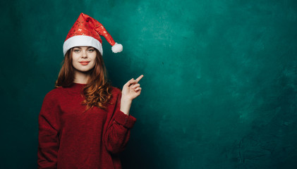 Woman in New Year's cap on a colored background
