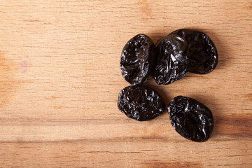 Dry prune on wood desk. 