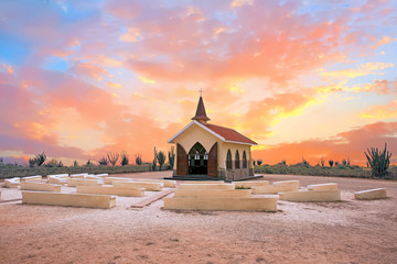 Alto Vista Chapel on Aruba island in the Caribbean at sunset - obrazy, fototapety, plakaty