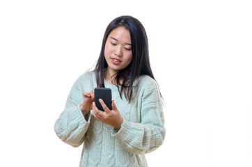 Young Chinese woman texting on her mobile