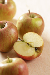 Red apples on a wooden table