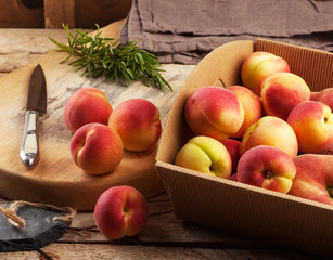 Apricots in a box on a rustic table