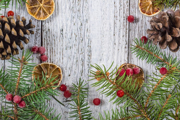 Christmas branches with cones viburnum berries and dry lemon slice