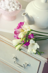freesias on chest of drawers