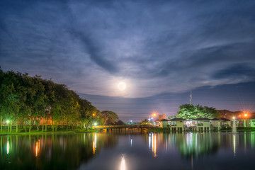 Fototapeta na wymiar Romantic scenic with full moon on public park
